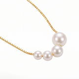 Elegant Gold Necklace with Freshwater Pearls — yellow gold, pendant close-up